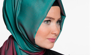 Başortülü memur için ilk vize!